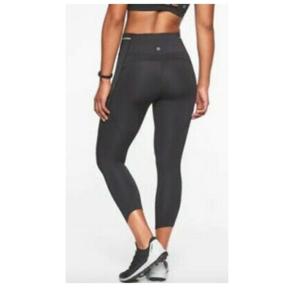 Athleta Black Sonic Capri Leggings size M High Rise Raw Hem Reflective